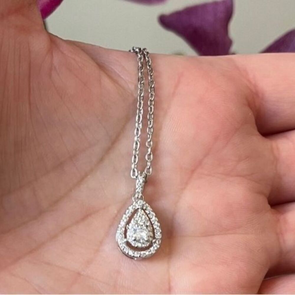 The Decadent Drop Moissanite teardrop pendant on 925 silver chain.